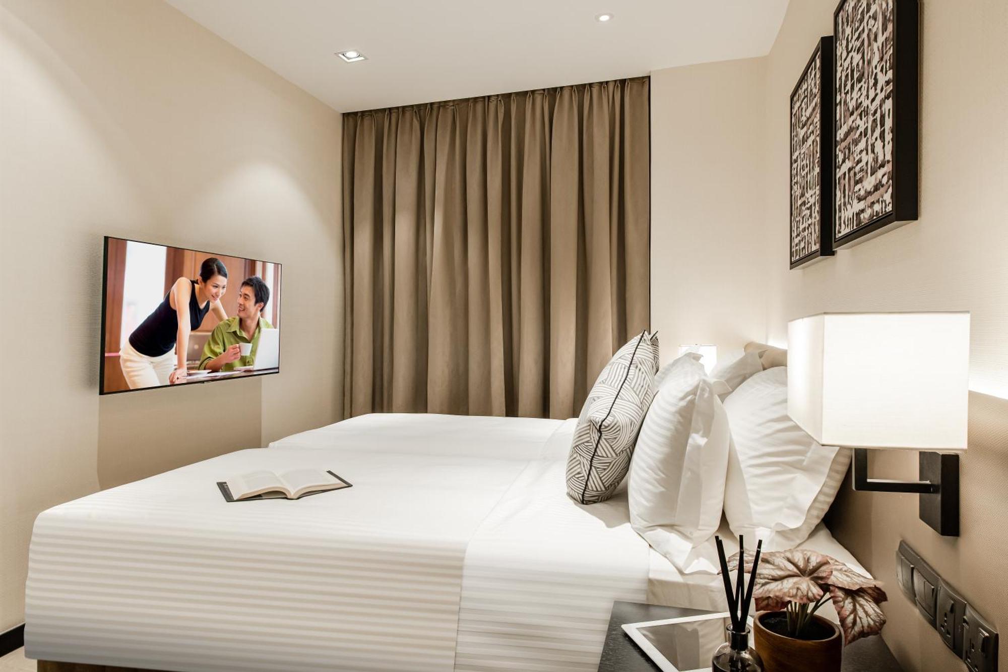 Ascott Star Klcc Kuala Lumpur Hotel ภายนอก รูปภาพ A bedroom at the hotel